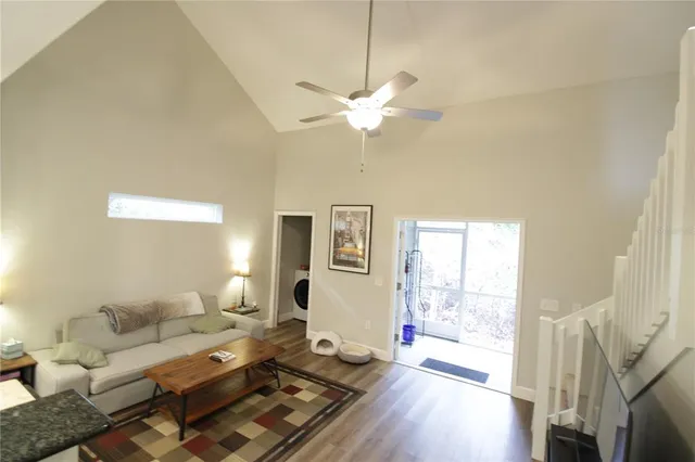 a living room with furniture or couch and a large window