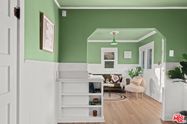 a bedroom with a bed and dresser