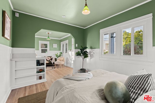 a bathroom with a sink mirror and a bathtub