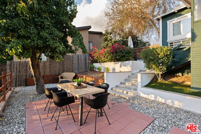 a view of a backyard with furniture