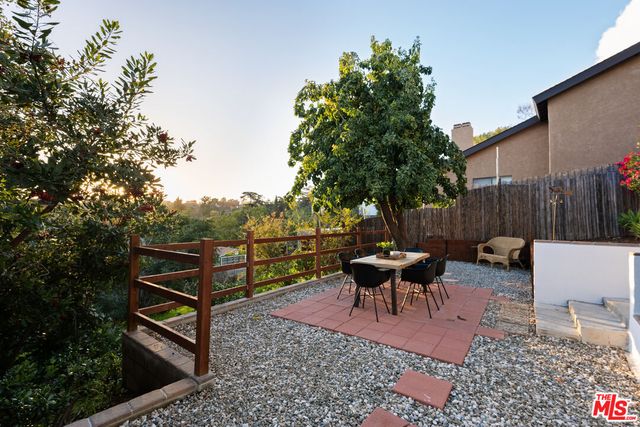 a aerial view of a house with a yard and tree s