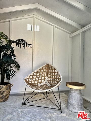 a view of a house with a small yard and plants