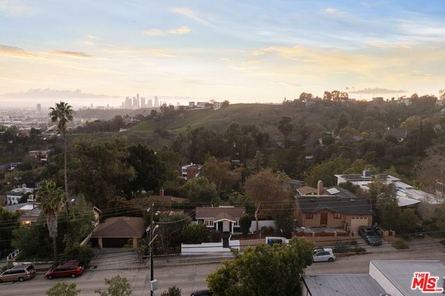 a front view of a house with wooden floor and a window