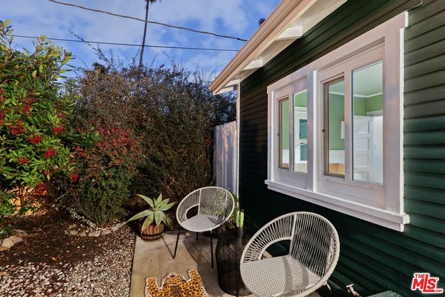 a backyard of a house with seating space