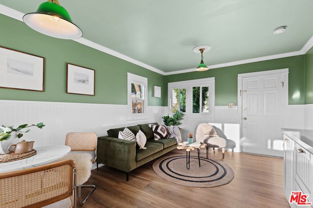 a kitchen with granite countertop a sink stainless steel appliances and cabinets