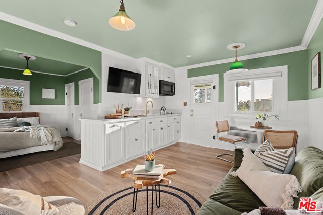 a living room with a flat screen tv and a couch