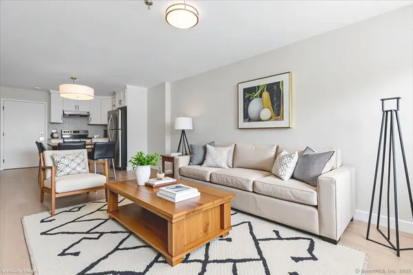 a living room with furniture and a large window