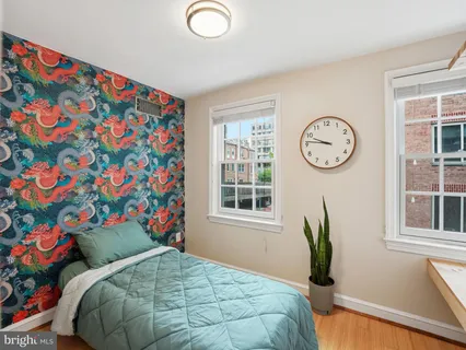 a bedroom with a bed and a window in it