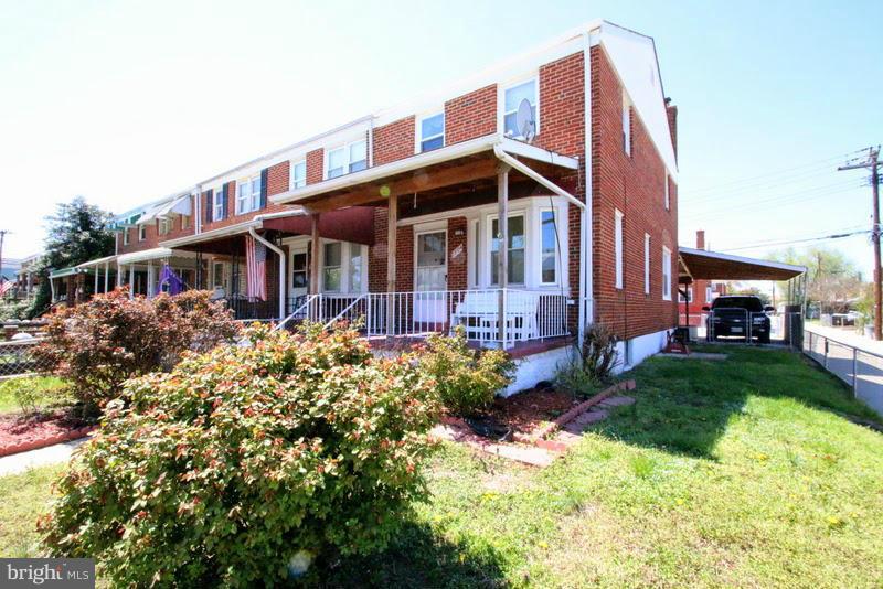 1904 Nevill Road Baltimore, MD 21222 - Photo 2 of 30 a view of a house with a yard and lawn chairs