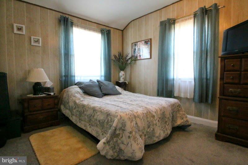 1904 Nevill Road Baltimore, MD 21222 - Photo 11 of 30 a bedroom with a bed and a television