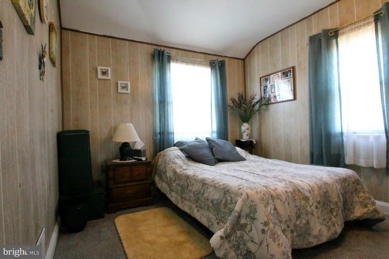 1904 Nevill Road Baltimore, MD 21222 - Photo 12 of 30 a bedroom with a bed and wooden floor