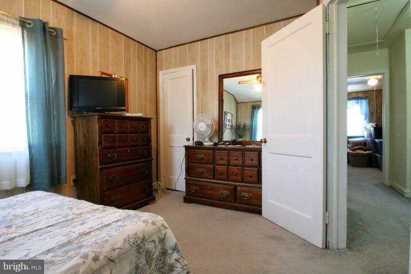 1904 Nevill Road Baltimore, MD 21222 - Photo 13 of 30 a bedroom with a bed and a flat tv screen in it