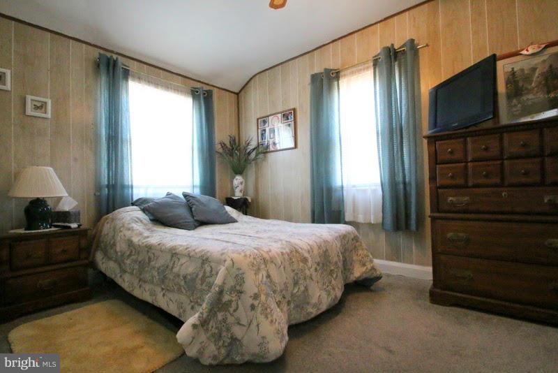 1904 Nevill Road Baltimore, MD 21222 - Photo 15 of 30 a bedroom with a bed closet and flat tv screen
