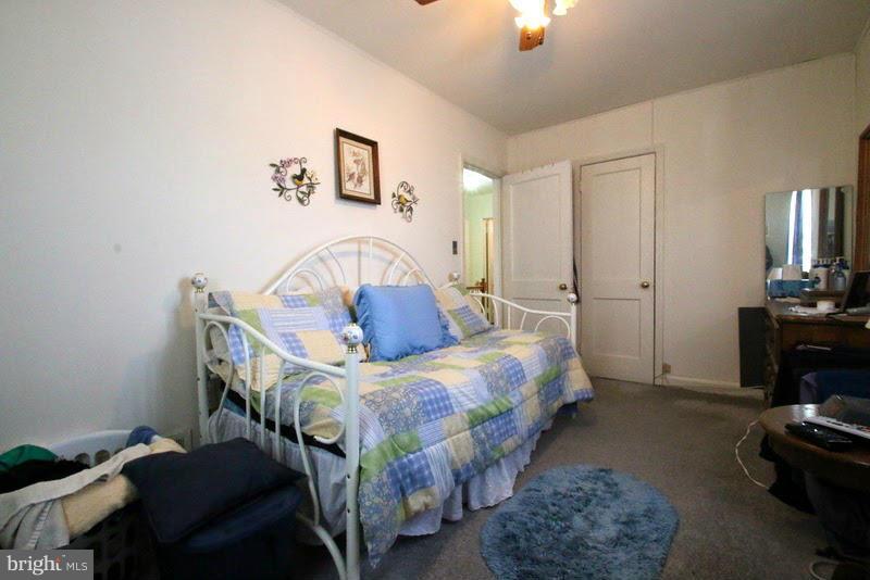 1904 Nevill Road Baltimore, MD 21222 - Photo 19 of 30 a bedroom with bed and a chandelier