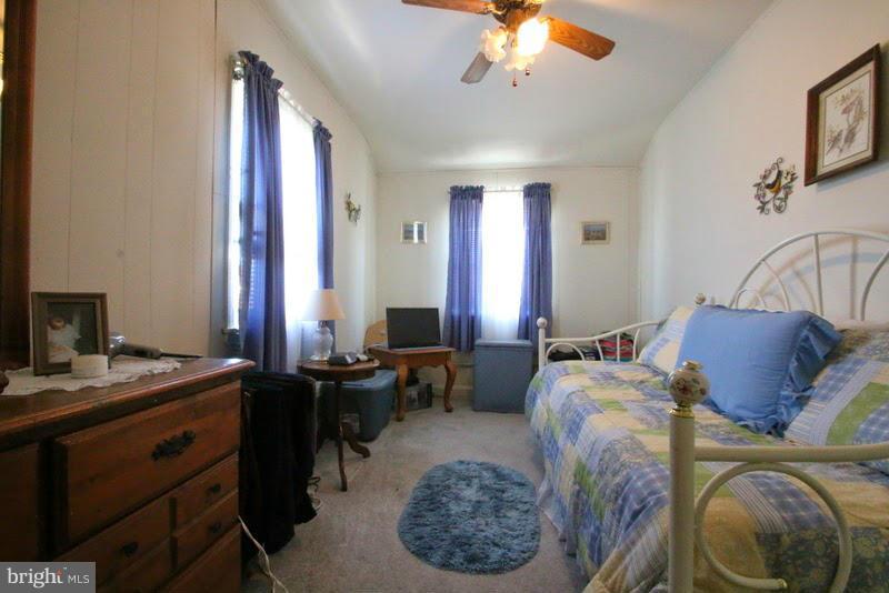 1904 Nevill Road Baltimore, MD 21222 - Photo 21 of 30 a bed room with a bed and a chandelier