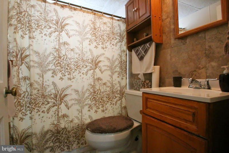1904 Nevill Road Baltimore, MD 21222 - Photo 24 of 30 a bathroom with a toilet and a sink
