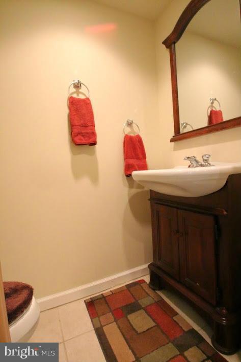1904 Nevill Road Baltimore, MD 21222 - Photo 25 of 30 a bathroom with a sink and a mirror