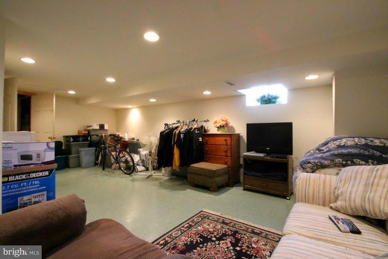 1904 Nevill Road Baltimore, MD 21222 - Photo 27 of 30 a living room with furniture and a flat screen tv