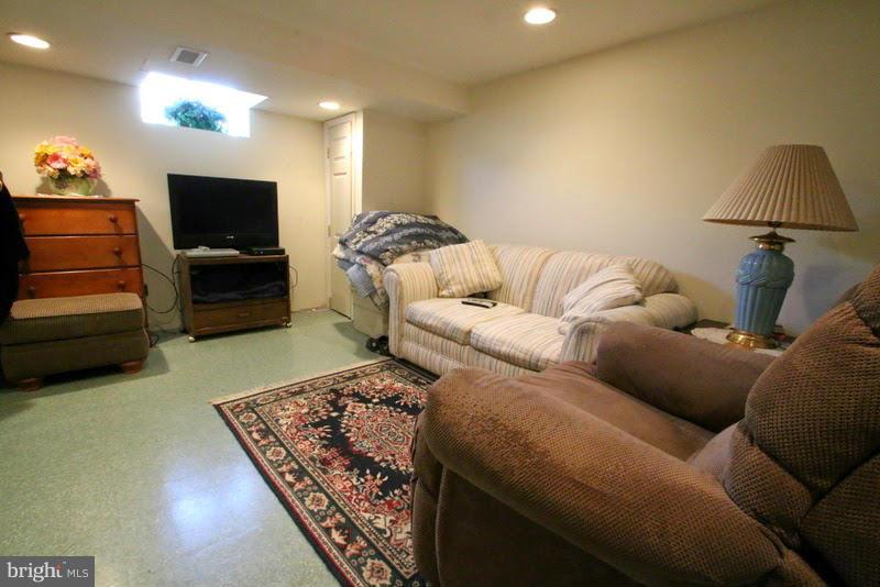 1904 Nevill Road Baltimore, MD 21222 - Photo 28 of 30 a living room with furniture and a flat screen tv