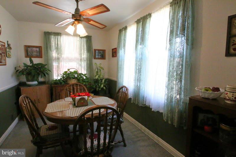 1904 Nevill Road Baltimore, MD 21222 - Photo 6 of 30 a view of a dining room with furniture window and wooden floor