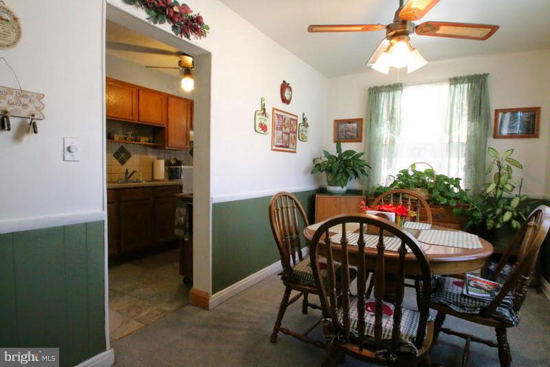 1904 Nevill Road Baltimore, MD 21222 - Photo 7 of 30 a view of a dining room with furniture and window
