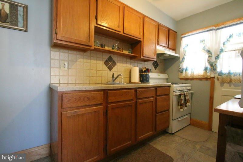 1904 Nevill Road Baltimore, MD 21222 - Photo 10 of 30 a kitchen with stainless steel appliances granite countertop a sink and cabinets