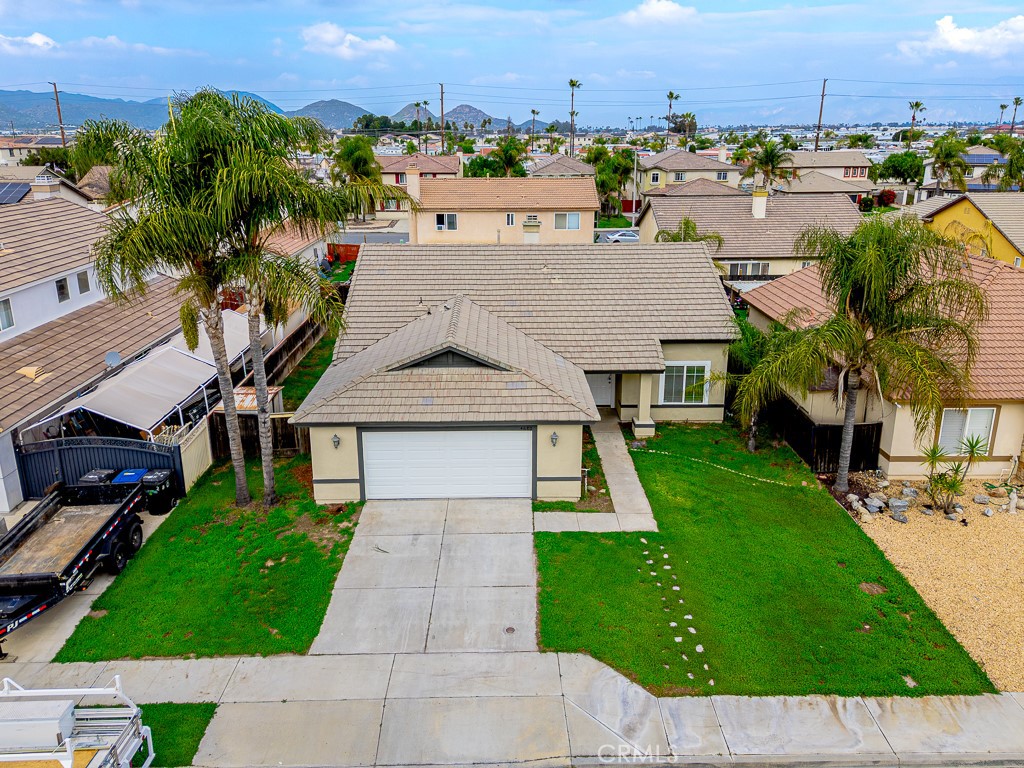 4680 Birchleaf Lane Hemet, CA 92545 - Photo 25 of 34 an aerial view of a house with a garden and trees