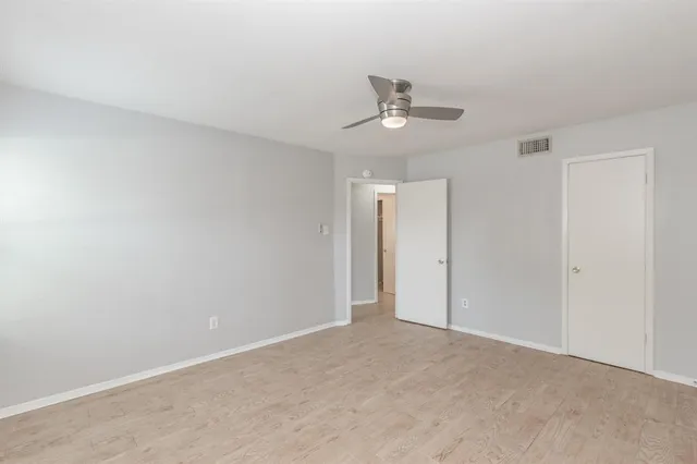 a view of a room with a hanging light