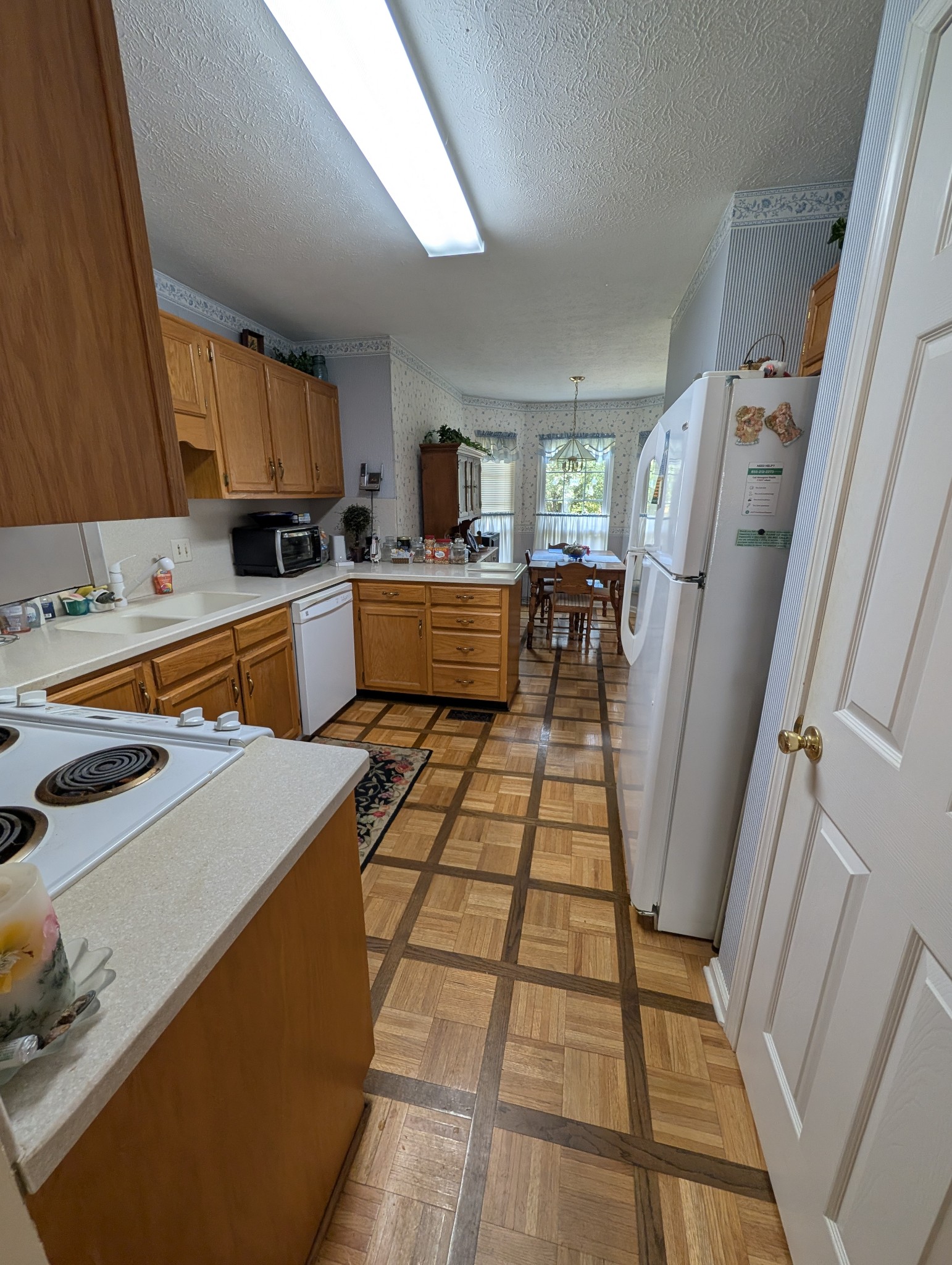 1401 Joe Pyron Drive Madison, TN 37115 - Photo 12 of 12 a kitchen with a sink a stove a refrigerator and cabinets