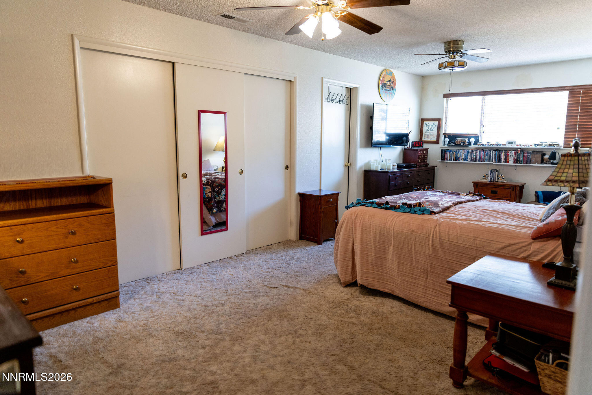 775 Meadow Valley Street Pioche, NV 89043 - Photo 12 of 26 a bedroom with a bed and a table in it