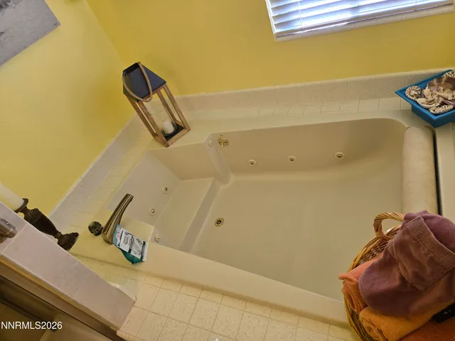 a view of storage and utility room with a window