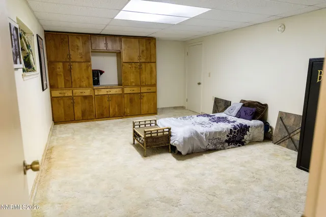 a bedroom with a bed and a cabinets