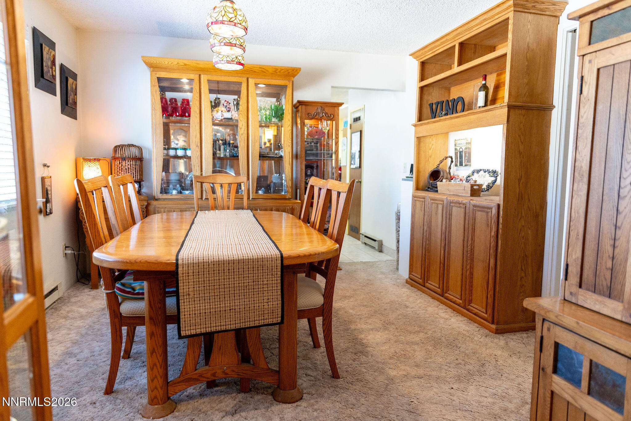 775 Meadow Valley Street Pioche, NV 89043 - Photo 6 of 26 a dining room with furniture a chandelier and window