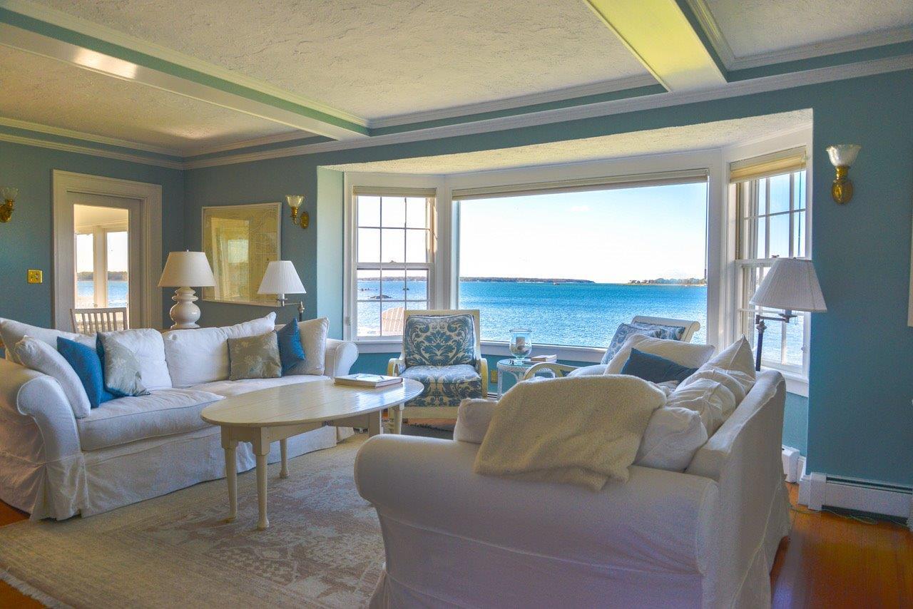 104 Rocky Point Road Bourne, MA 02532 - Photo 1 of 22 a living room with furniture and a large window