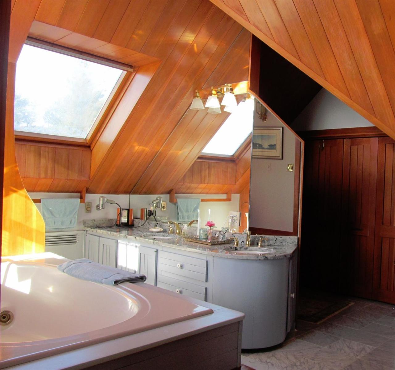 104 Rocky Point Road Bourne, MA 02532 - Photo 13 of 22 a kitchen with stainless steel appliances a sink a stove and a microwave