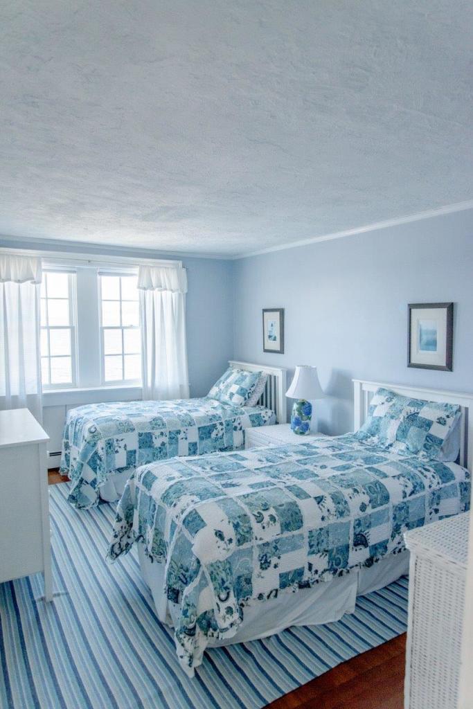 104 Rocky Point Road Bourne, MA 02532 - Photo 15 of 22 a view of a bedroom with wooden floor