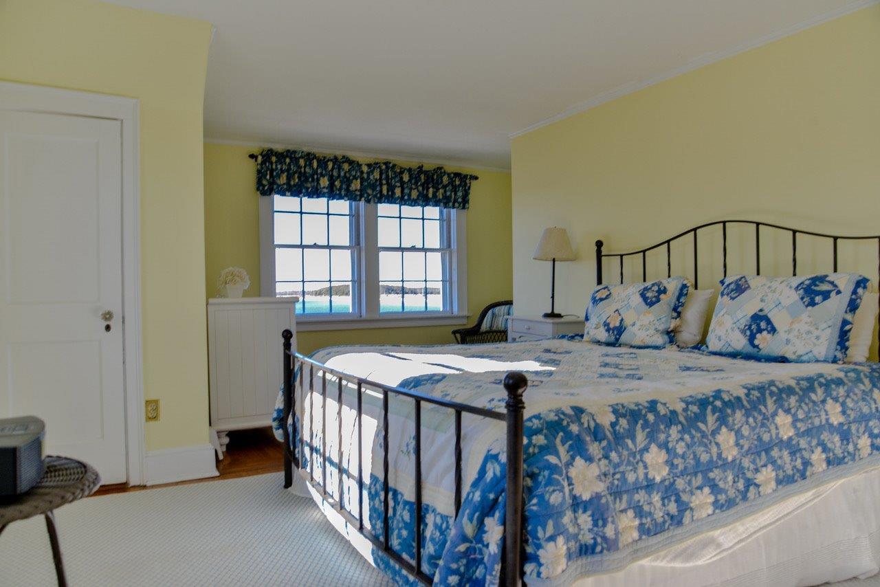 104 Rocky Point Road Bourne, MA 02532 - Photo 16 of 22 a bedroom with a bed and a window