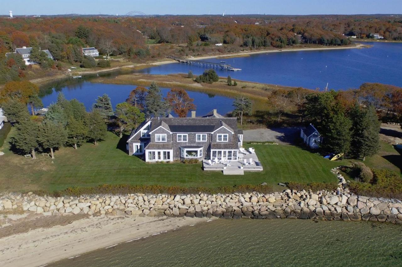 104 Rocky Point Road Bourne, MA 02532 - Photo 20 of 22 a view of a lake with a mountain in the background