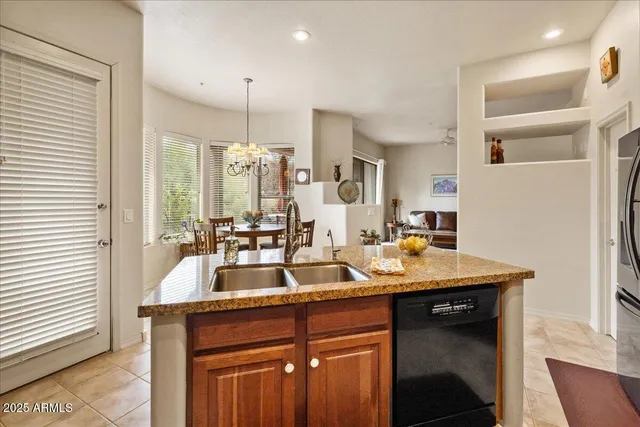 a kitchen with a sink and a refrigerator