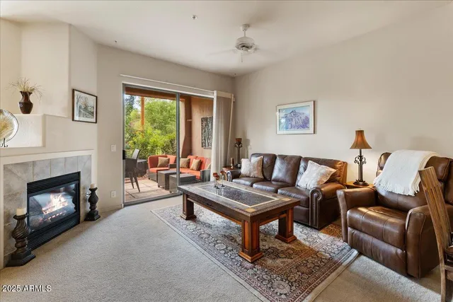 a living room with furniture and a fireplace