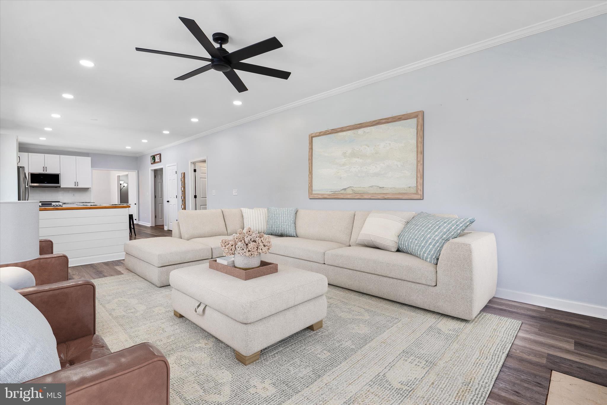 913 Clark Corner Road Centreville, MD 21617 - Photo 14 of 66 a living room with furniture kitchen view and a chandelier