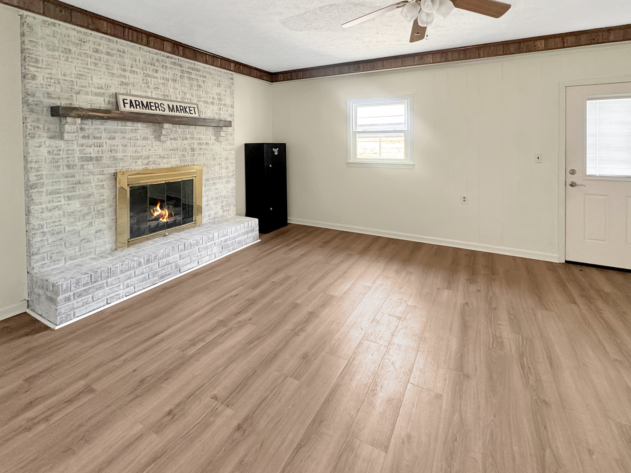 75 Towering Oaks Road Tennessee Ridge, TN 37178 - Photo 5 of 18 a view of empty room with wooden floor and fireplace