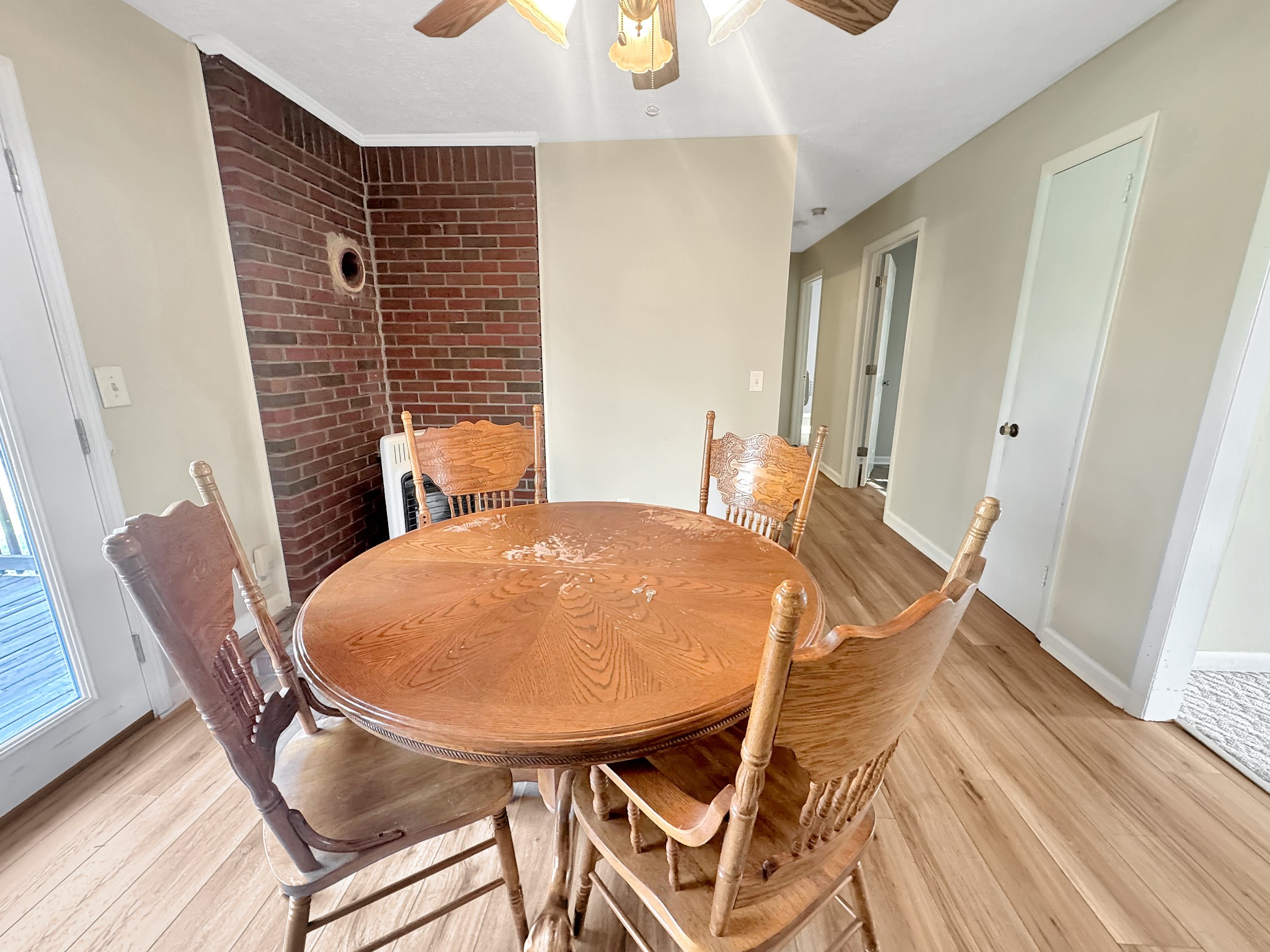 75 Towering Oaks Road Tennessee Ridge, TN 37178 - Photo 9 of 18 a view of a dining room with furniture and wooden floor
