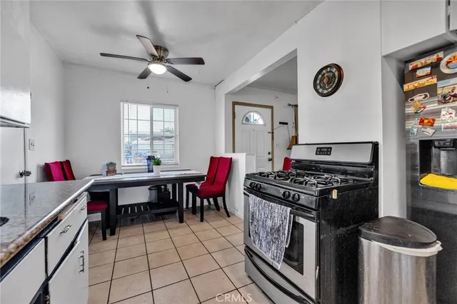 a kitchen with a stove and a table