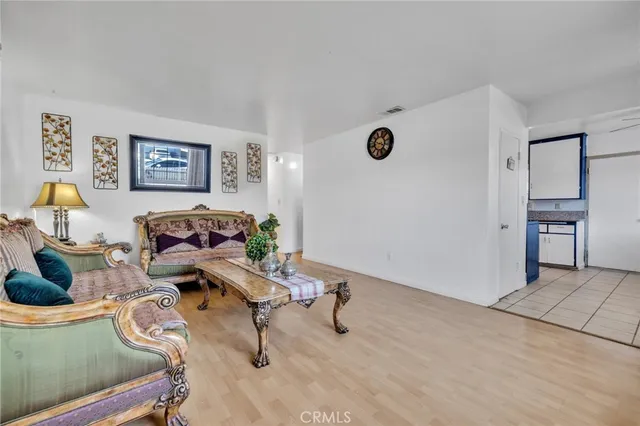 a living room with furniture and a table