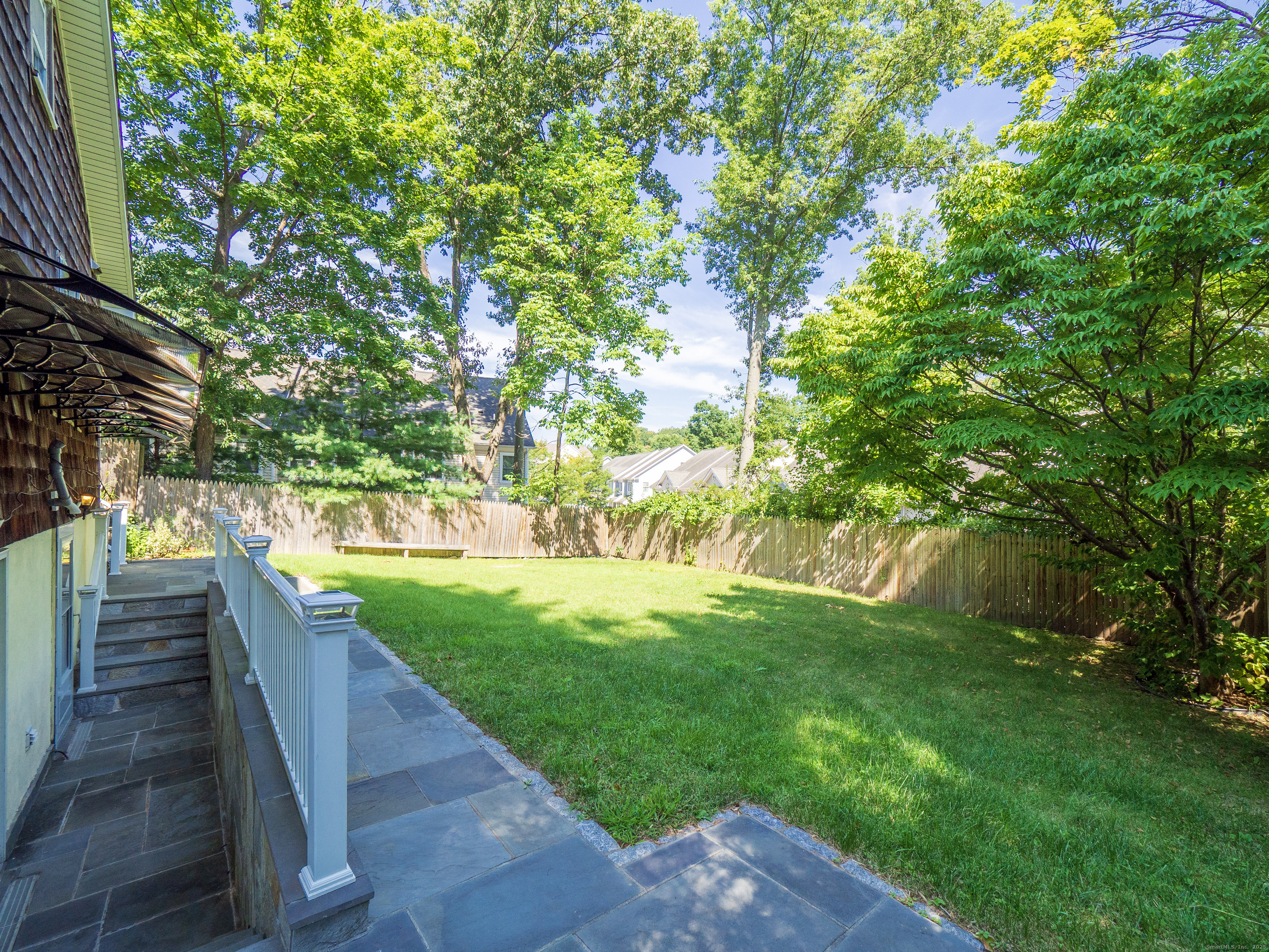 74 Lakeview Avenue New Canaan, CT 06840 - Photo 3 of 15 a view of a garden with wooden floor
