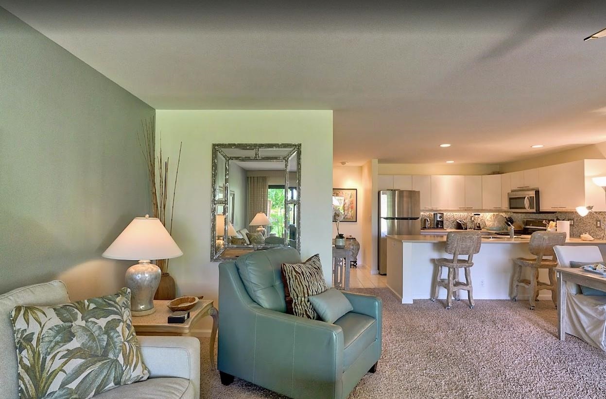 2777 South Kihei Road, Unit D109 Kihei, HI 96753 - Photo 12 of 50 a living room with furniture and a table