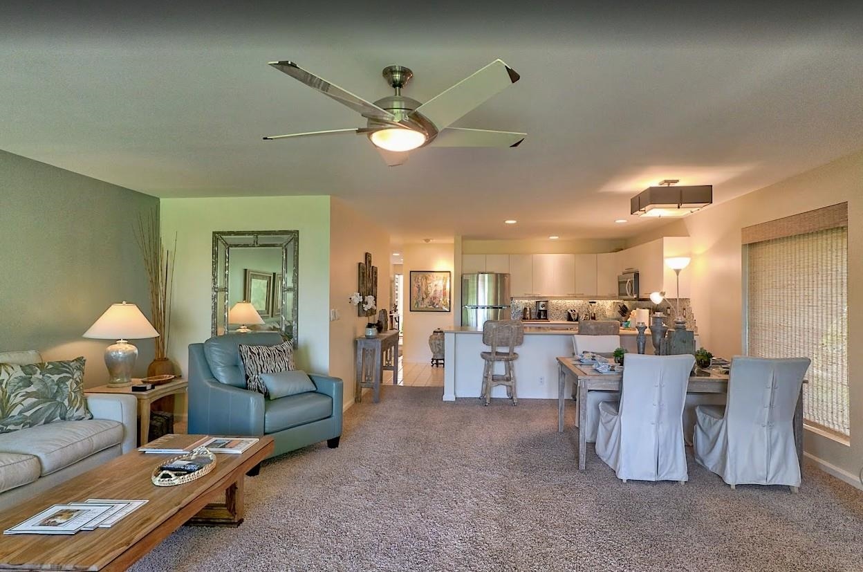 2777 South Kihei Road, Unit D109 Kihei, HI 96753 - Photo 19 of 50 a living room with furniture and a chandelier