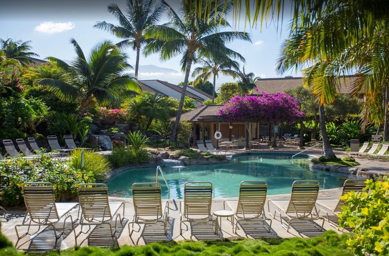 2777 South Kihei Road, Unit D109 Kihei, HI 96753 - Photo 44 of 50 a view of a chairs and table in a backyard