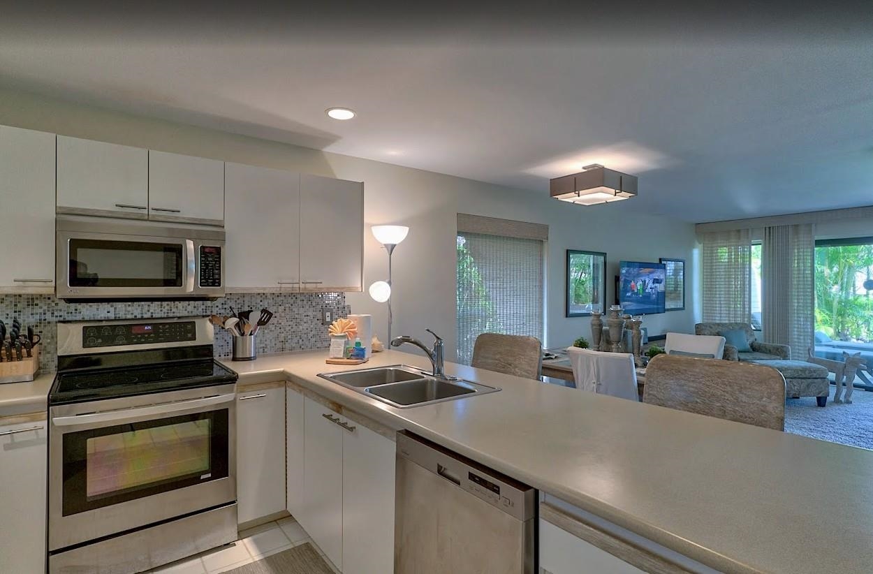 2777 South Kihei Road, Unit D109 Kihei, HI 96753 - Photo 8 of 50 a kitchen with sink a microwave and stove